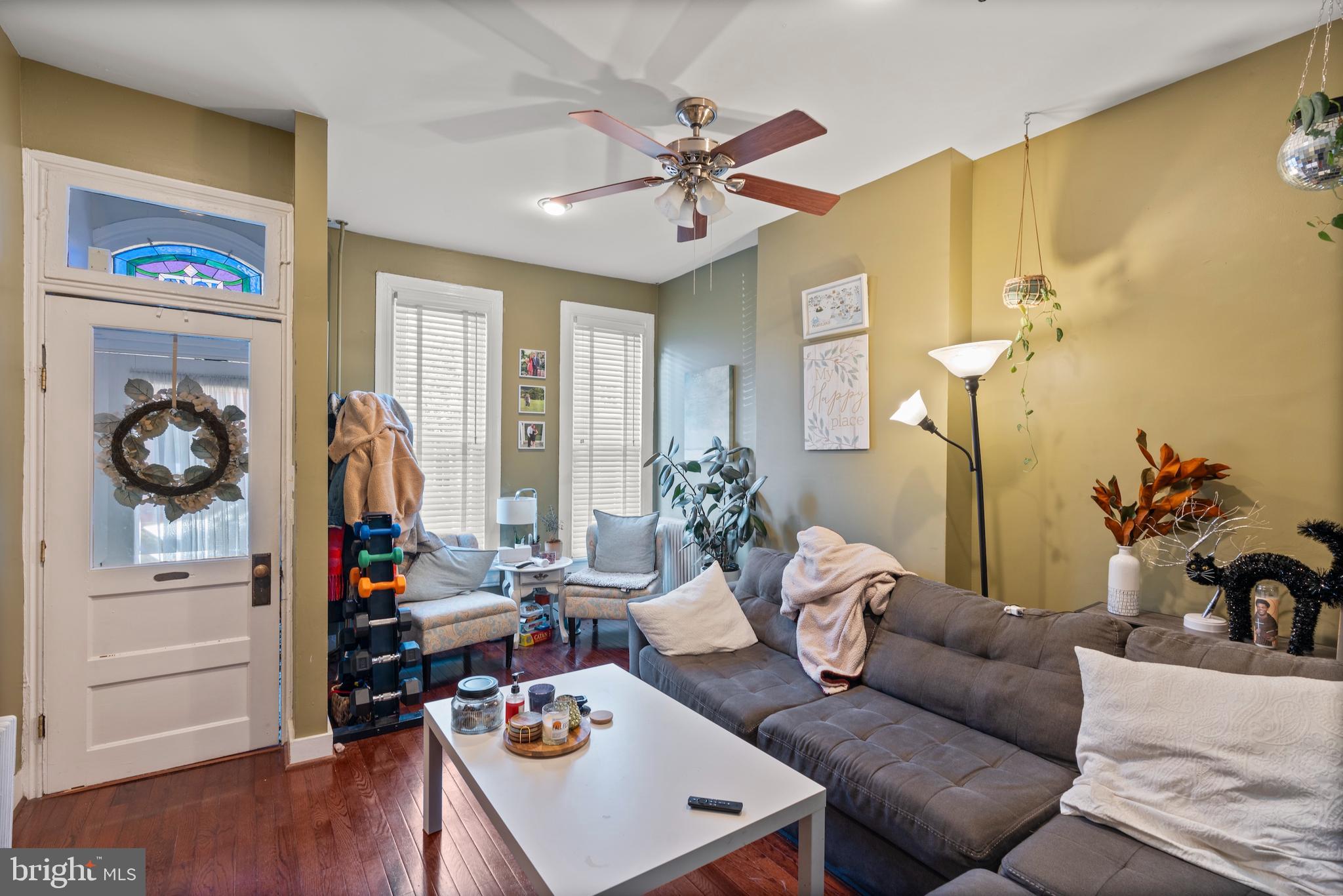 1043 Riverside Avenue Baltimore, MD 21230 - Photo 8 of 41 a living room with furniture and wooden floor