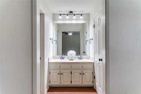 a bathroom with a shower sink and mirror