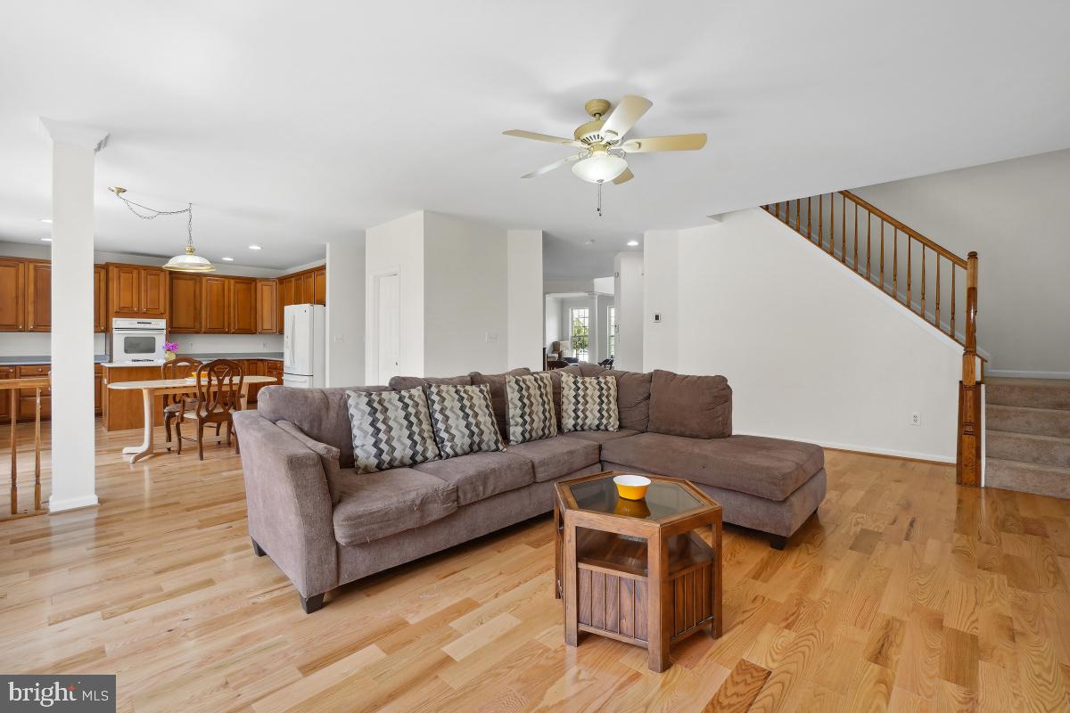 18521 Cornflower Road Boyds, MD 20841 - Photo 15 of 62 a living room with furniture and wooden floor