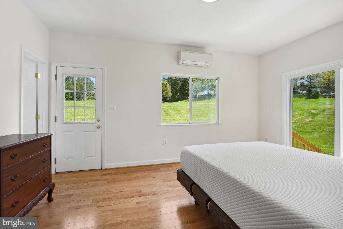 18521 Cornflower Road Boyds, MD 20841 - Photo 16 of 62 a bedroom with a bed and a window