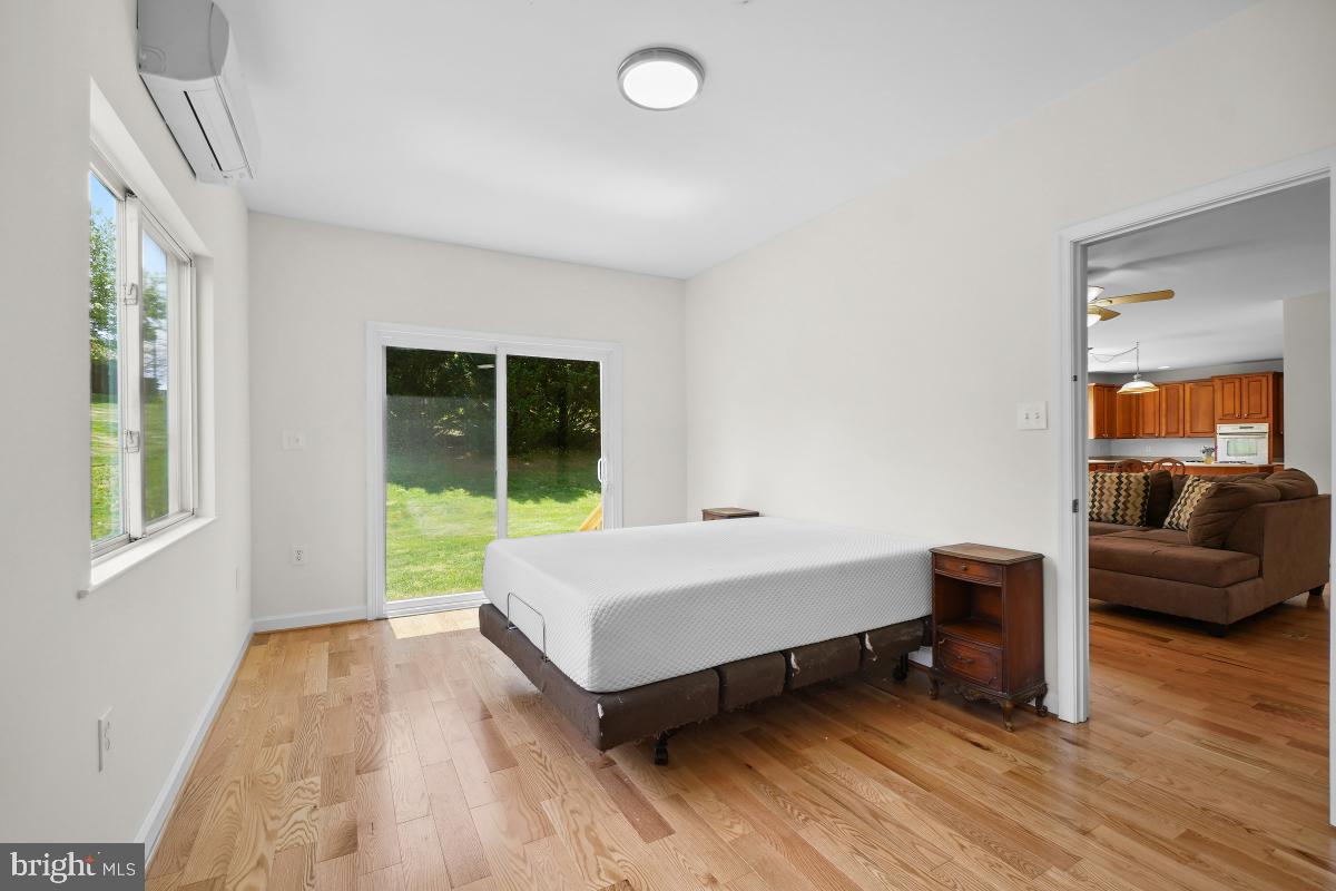18521 Cornflower Road Boyds, MD 20841 - Photo 17 of 62 a spacious bedroom with a bed and a couch