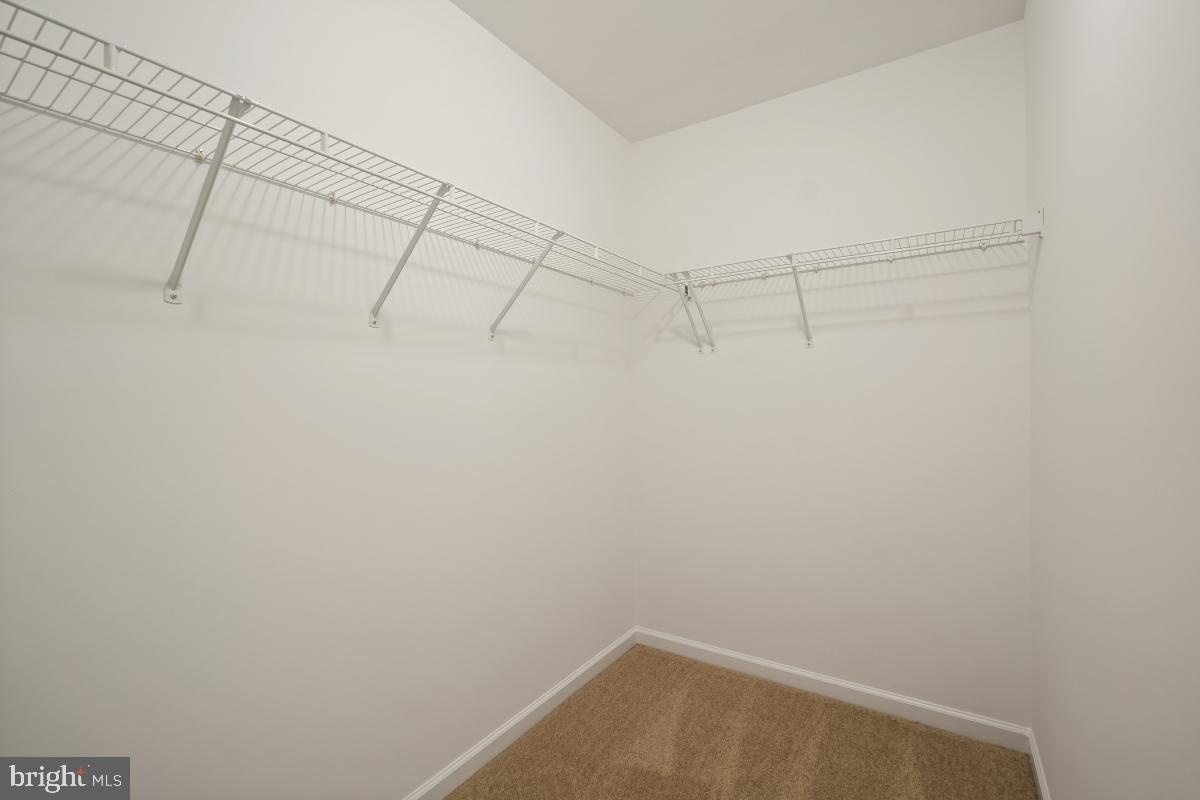 18521 Cornflower Road Boyds, MD 20841 - Photo 24 of 62 a view of a room with racks on the wall