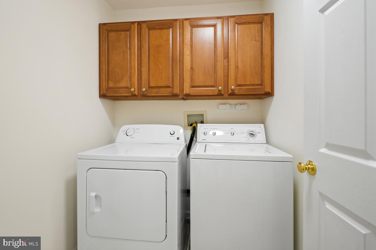 18521 Cornflower Road Boyds, MD 20841 - Photo 32 of 62 a utility room with dryer and washer