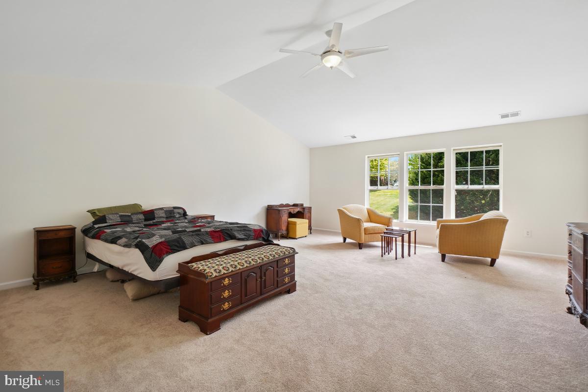 18521 Cornflower Road Boyds, MD 20841 - Photo 33 of 62 a bedroom with furniture and a large window