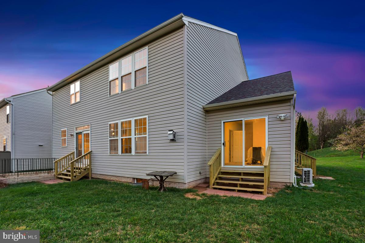 18521 Cornflower Road Boyds, MD 20841 - Photo 42 of 62 a front view of a house with a garden