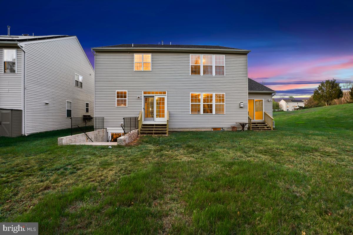 18521 Cornflower Road Boyds, MD 20841 - Photo 43 of 62 a front view of a house with a yard