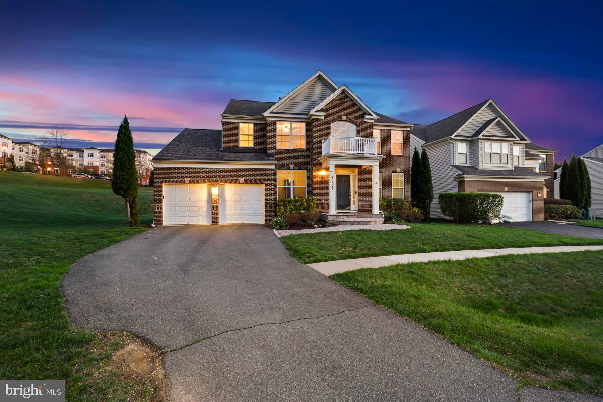 18521 Cornflower Road Boyds, MD 20841 - Photo 45 of 62 a front view of a house with a yard