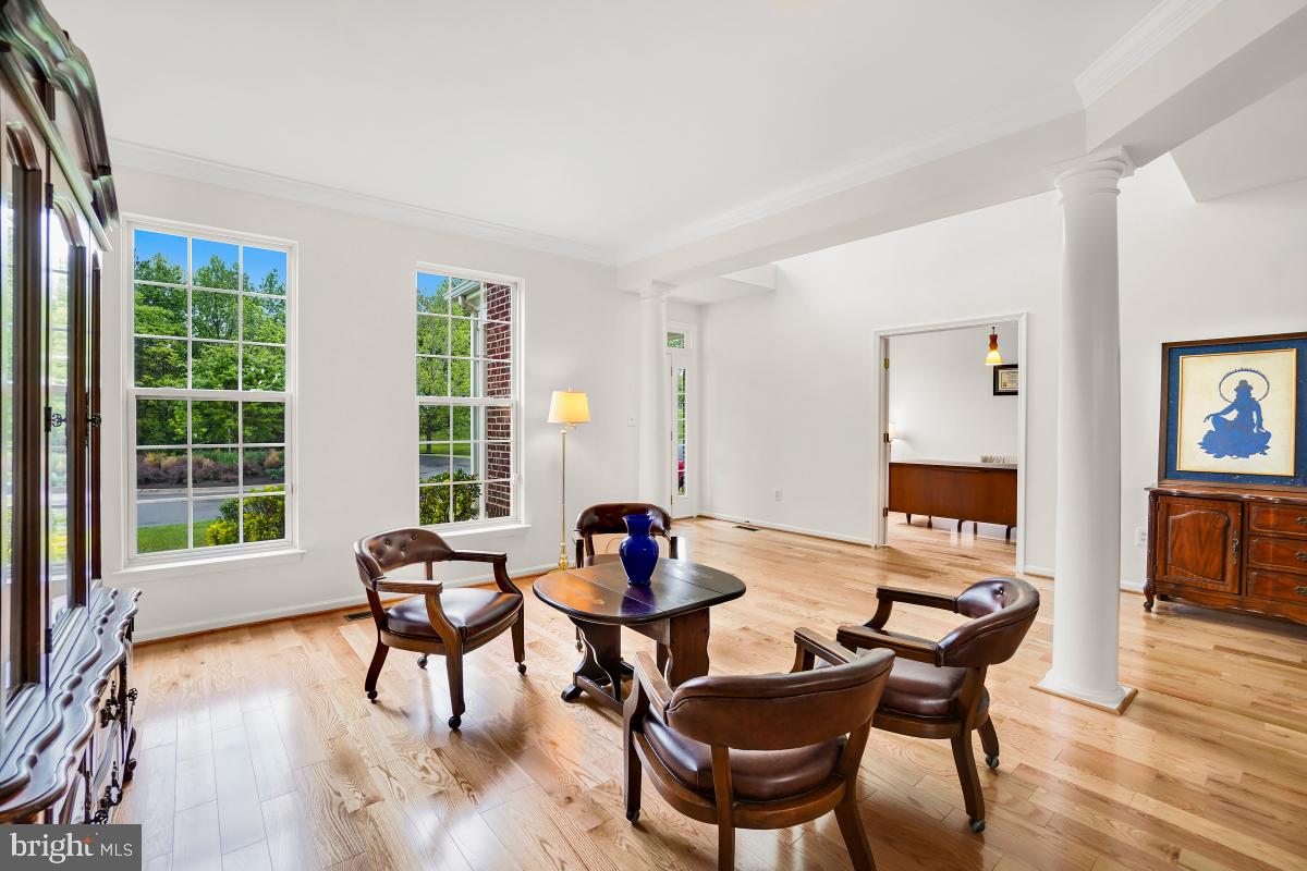 18521 Cornflower Road Boyds, MD 20841 - Photo 48 of 62 a living room with furniture and floor to ceiling window