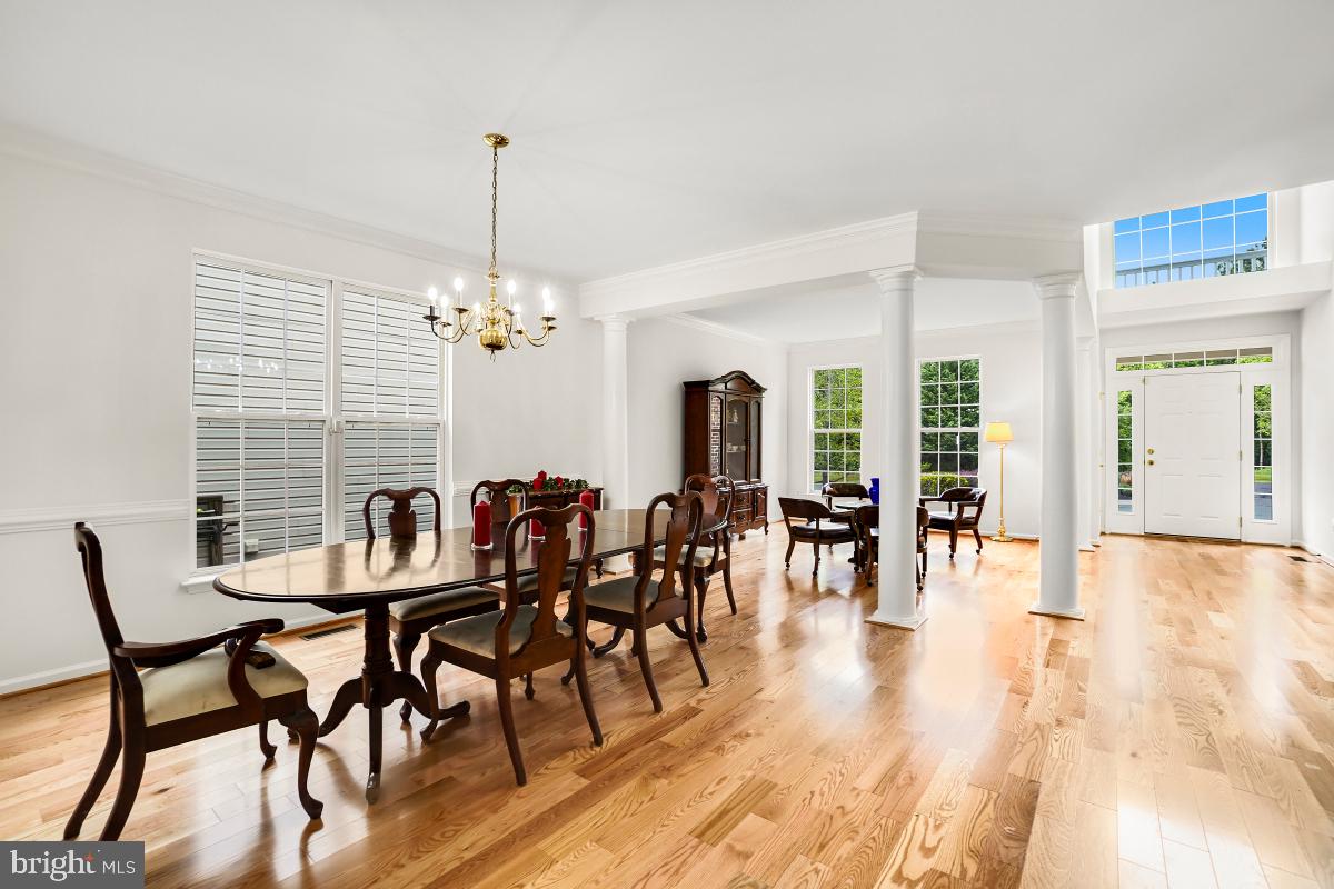18521 Cornflower Road Boyds, MD 20841 - Photo 49 of 62 a view of a a dining room with furniture window and wooden floor