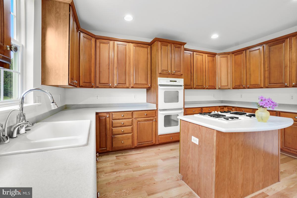 18521 Cornflower Road Boyds, MD 20841 - Photo 50 of 62 a kitchen with a sink stove and refrigerator