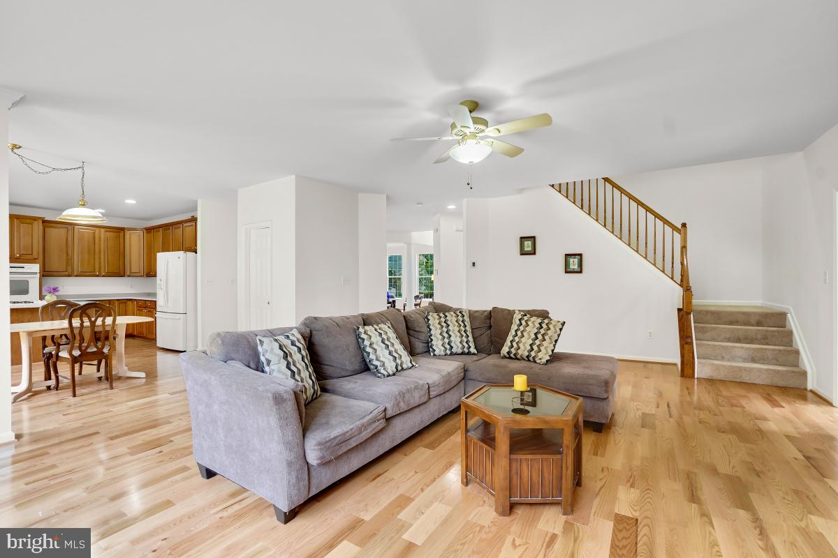 18521 Cornflower Road Boyds, MD 20841 - Photo 54 of 62 a living room with furniture and wooden floor