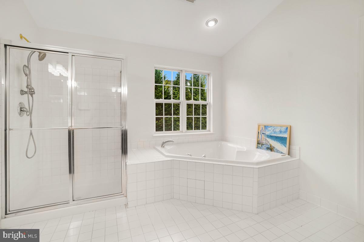 18521 Cornflower Road Boyds, MD 20841 - Photo 59 of 62 a bathroom with a bathtub and a shower