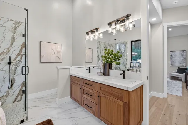 a roof deck with table and chairs wooden floor and fence