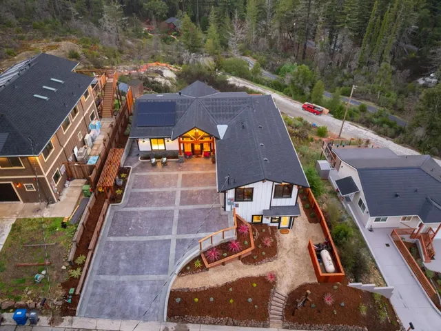 a living room with furniture a window and flowerpot