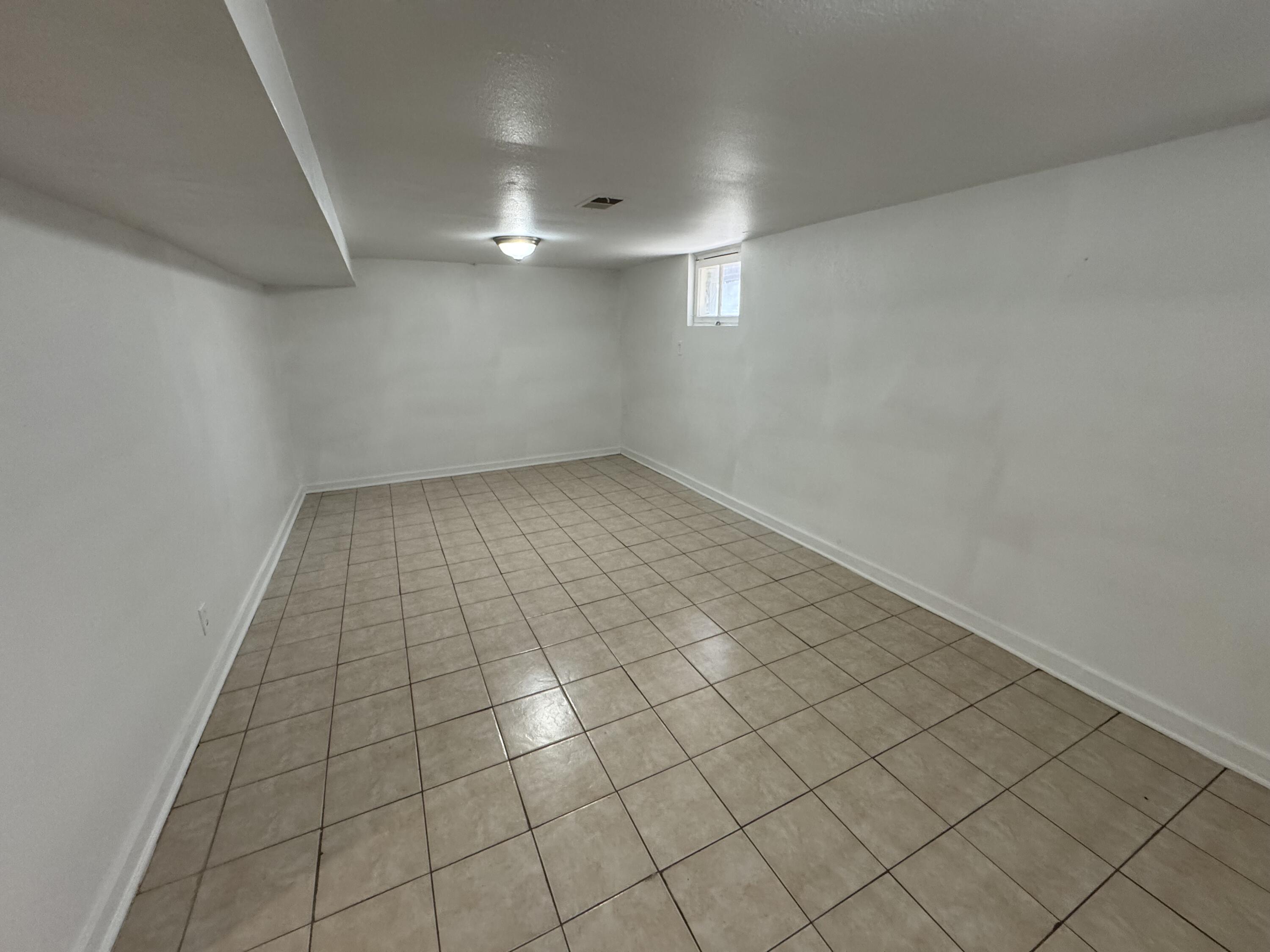 3844 Adams Street Gary, IN 46408 - Photo 15 of 17 an empty room with white walls and tiles
