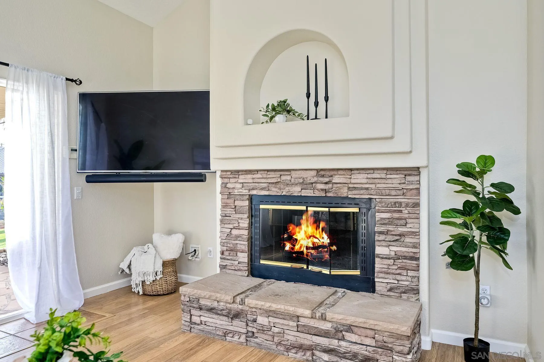 2859 Manzanita View Road Alpine, CA 91901 - Photo 20 of 66 a living room with furniture a fireplace and a potted plant