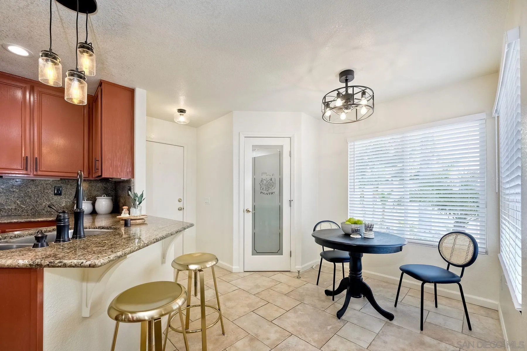 2859 Manzanita View Road Alpine, CA 91901 - Photo 23 of 66 a view of a kitchen area with granite countertop chairs and couches