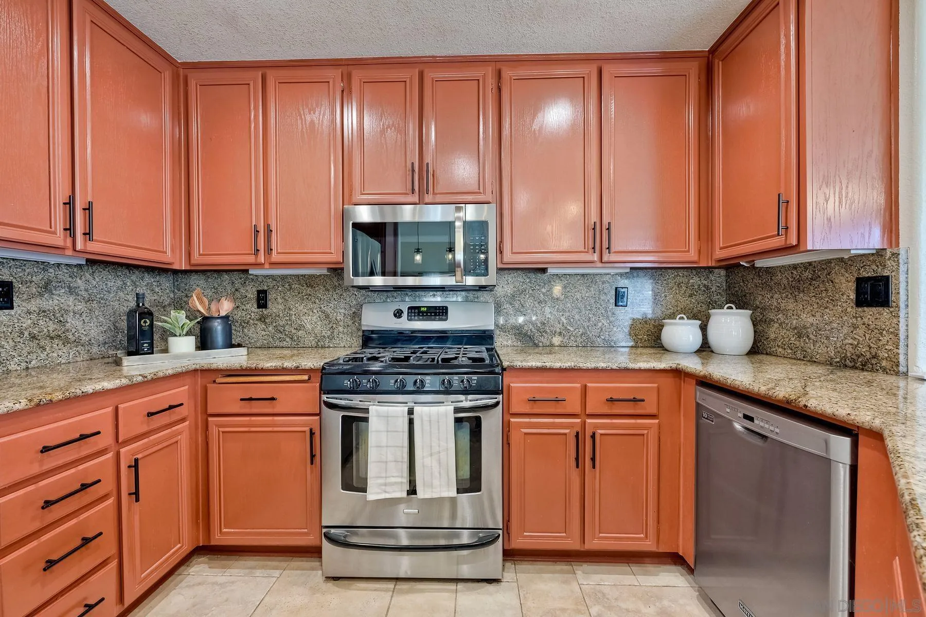 2859 Manzanita View Road Alpine, CA 91901 - Photo 25 of 66 a kitchen with stainless steel appliances granite countertop a stove a sink and a microwave