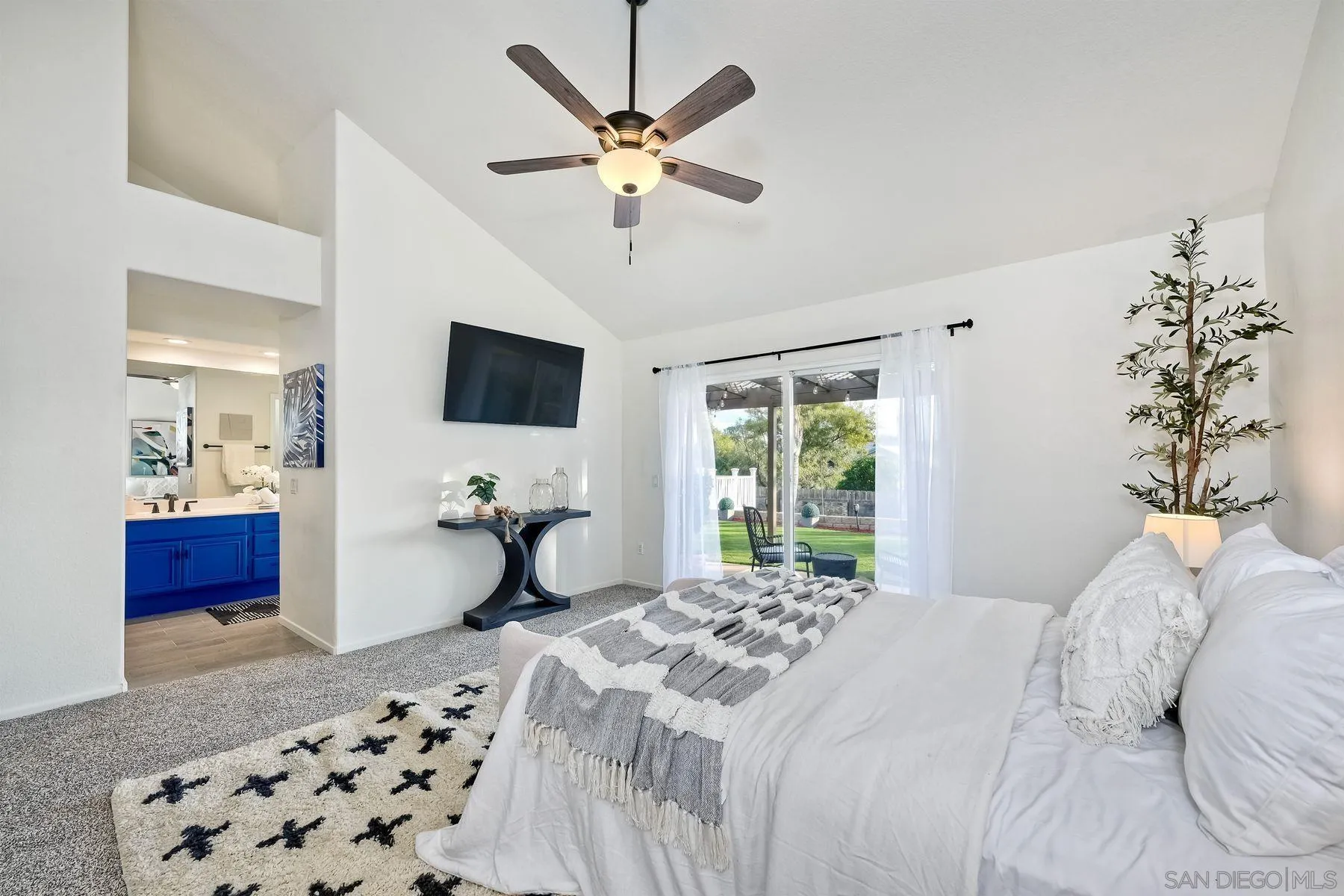 2859 Manzanita View Road Alpine, CA 91901 - Photo 29 of 66 a bedroom with a bed and a chandelier