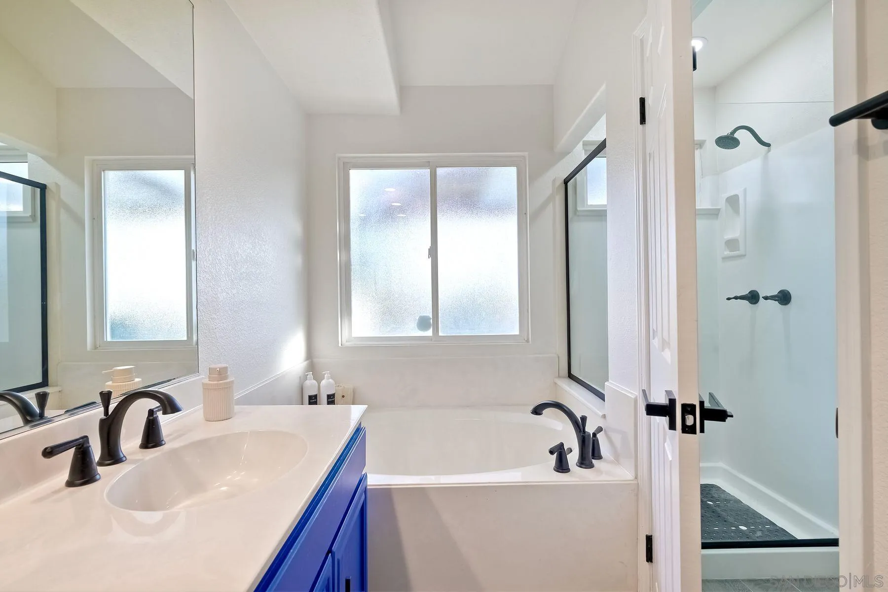2859 Manzanita View Road Alpine, CA 91901 - Photo 31 of 66 a bathroom with a sink tub vanity and shower