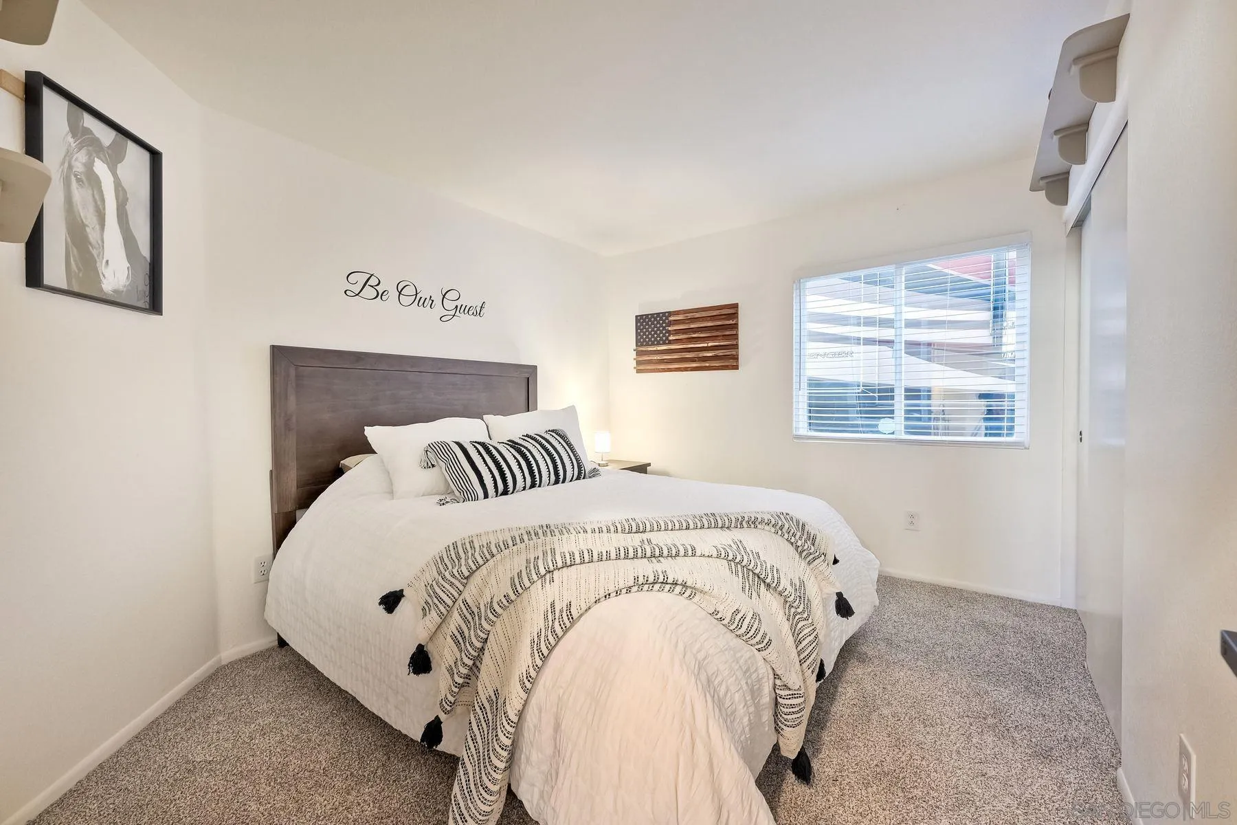 2859 Manzanita View Road Alpine, CA 91901 - Photo 36 of 66 a spacious bedroom with a bed and a window