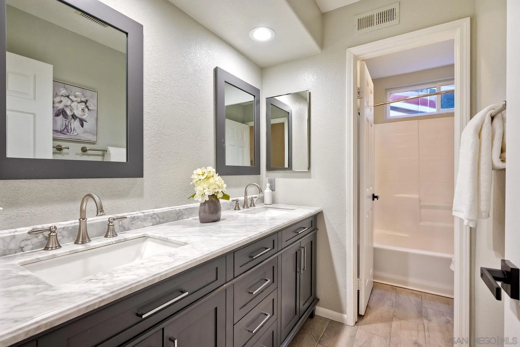 2859 Manzanita View Road Alpine, CA 91901 - Photo 37 of 66 a bathroom with a double vanity sink and a mirror