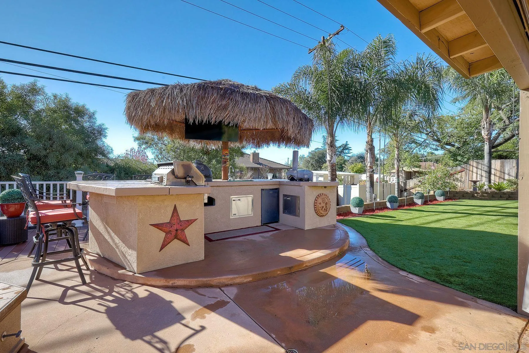 2859 Manzanita View Road Alpine, CA 91901 - Photo 45 of 66 a view of a patio with a table and chairs under an umbrella