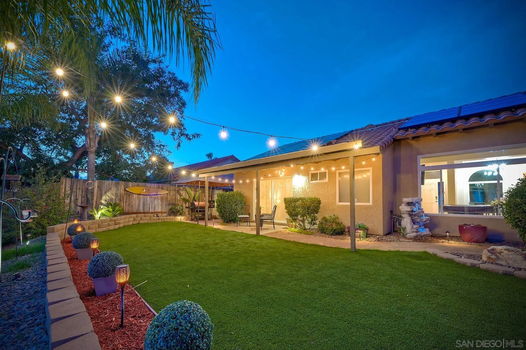2859 Manzanita View Road Alpine, CA 91901 - Photo 57 of 66 a view of a patio with table and chairs and potted plants with wooden fence