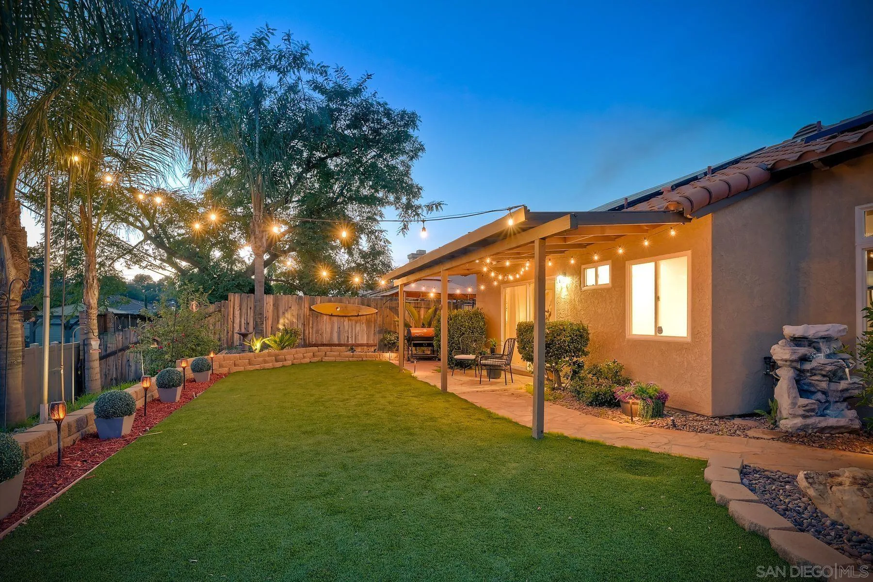 2859 Manzanita View Road Alpine, CA 91901 - Photo 58 of 66 a backyard of a house with table and chairs with plants