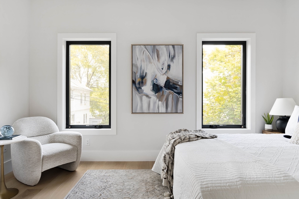 8 Poplar Road, Unit A Cambridge, MA 02138 - Photo 16 of 35 a bedroom with a bed and a window