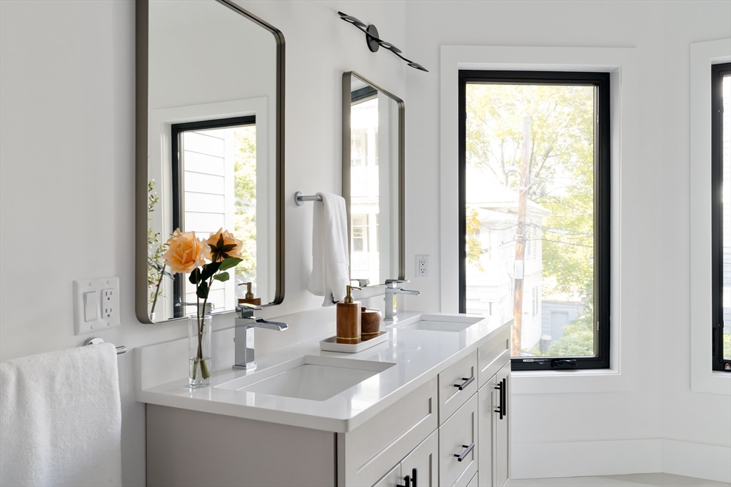 8 Poplar Road, Unit A Cambridge, MA 02138 - Photo 21 of 35 a bathroom with a sink and a mirror