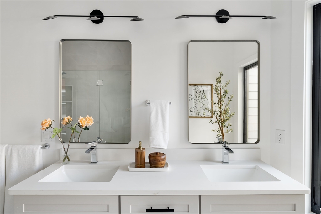 8 Poplar Road, Unit A Cambridge, MA 02138 - Photo 22 of 35 a bathroom with a sink and a mirror