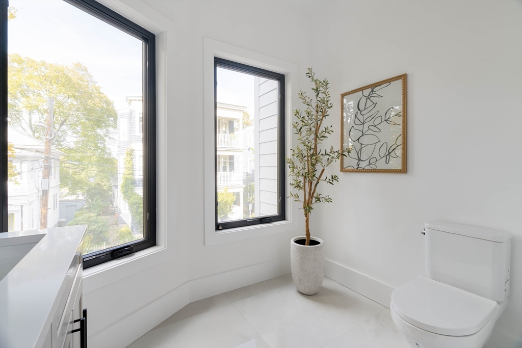 8 Poplar Road, Unit A Cambridge, MA 02138 - Photo 23 of 35 a bathroom with a toilet and a bathtub
