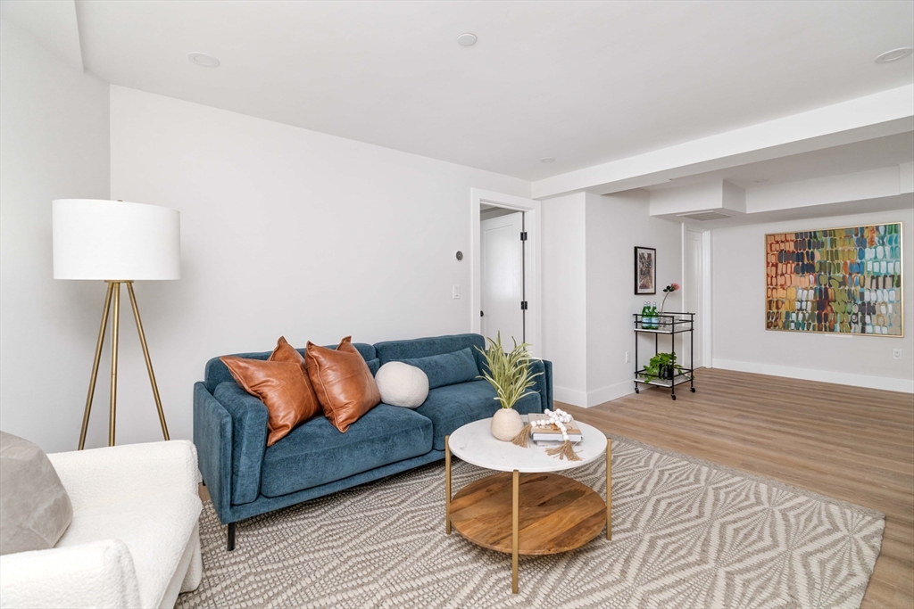 8 Poplar Road, Unit A Cambridge, MA 02138 - Photo 24 of 35 a living room with furniture and a table
