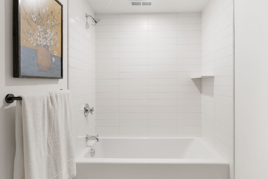 8 Poplar Road, Unit A Cambridge, MA 02138 - Photo 29 of 35 a bathroom with a bathtub