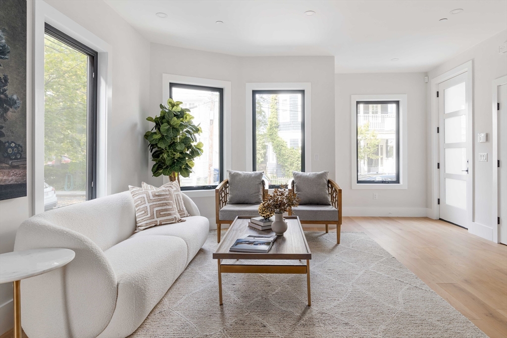 8 Poplar Road, Unit A Cambridge, MA 02138 - Photo 7 of 35 a living room with furniture and a large window