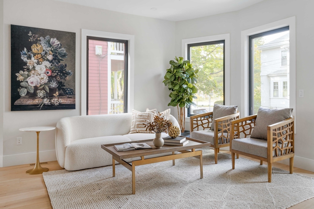 8 Poplar Road, Unit A Cambridge, MA 02138 - Photo 8 of 35 a living room with furniture and a large window