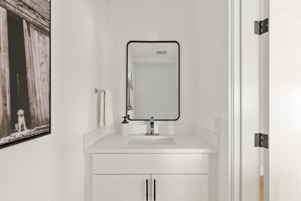 8 Poplar Road, Unit A Cambridge, MA 02138 - Photo 9 of 35 a bathroom with a sink and a mirror