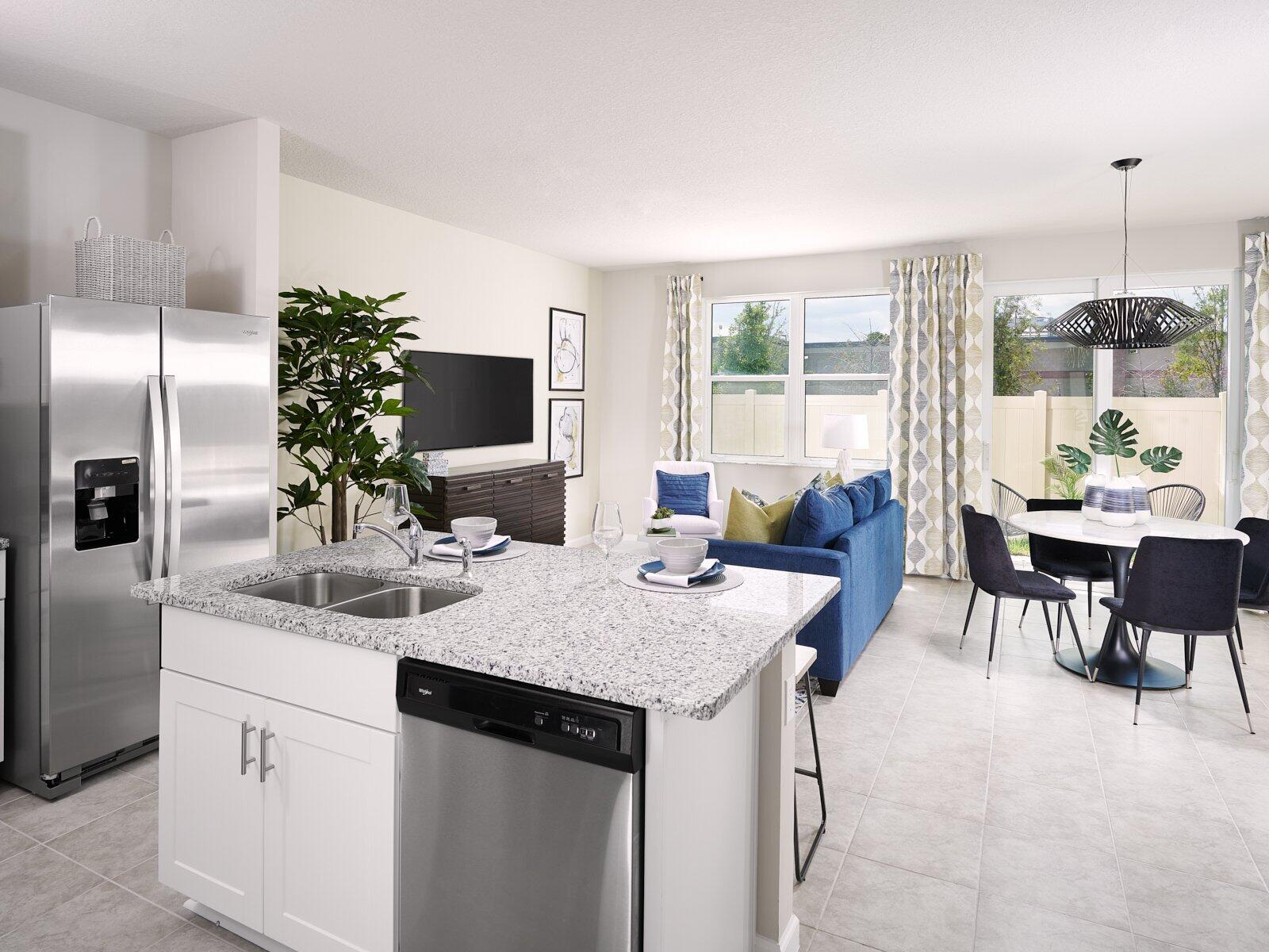12949 Southwest Forli Way Port St. Lucie, FL 34987 - Photo 4 of 13 a kitchen with a center island and some cabinets