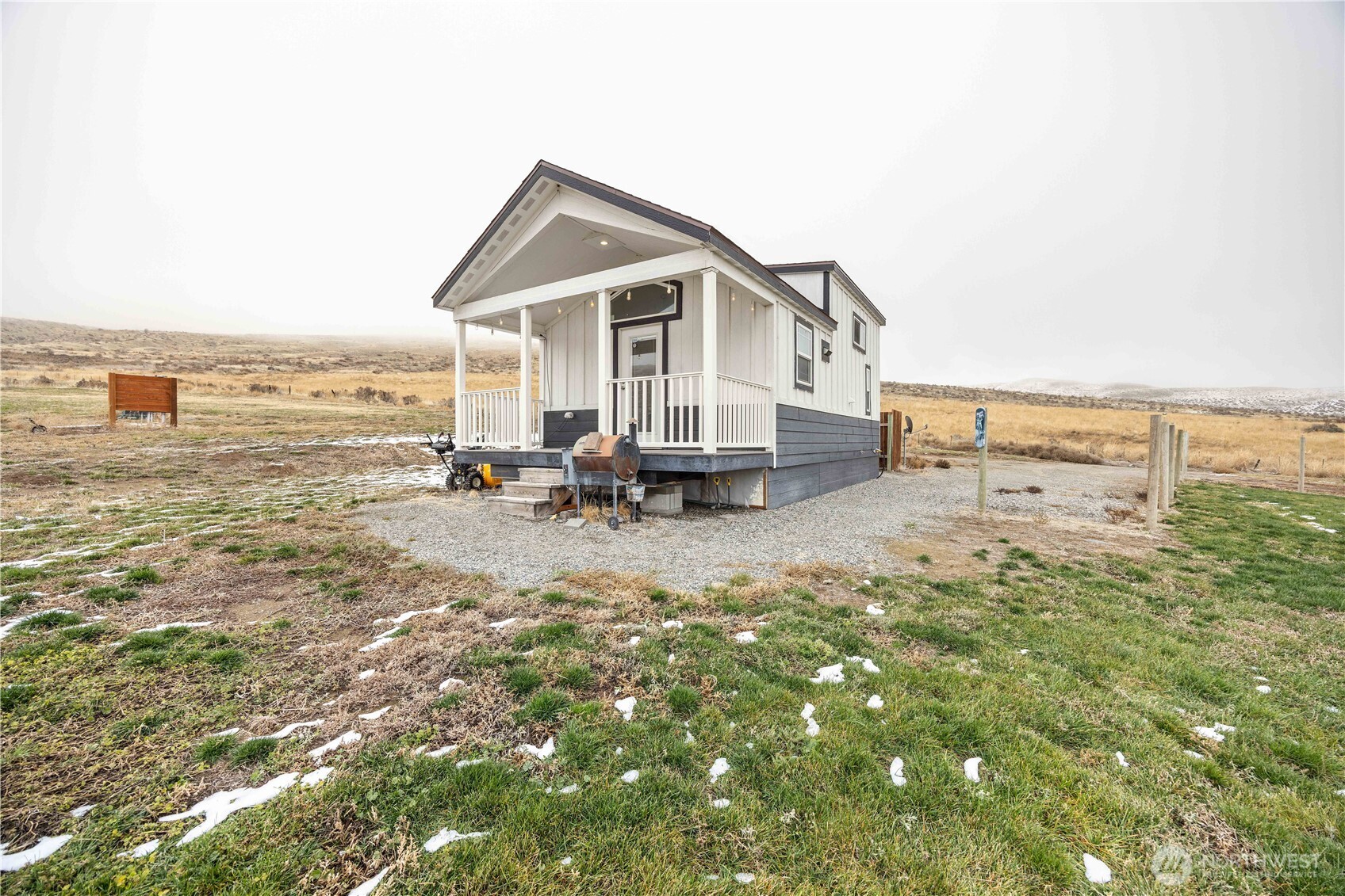 577 Bill Shaw Road Pateros, WA 98846 - Photo 3 of 40 a view of a terrace with a table and chairs under an umbrella