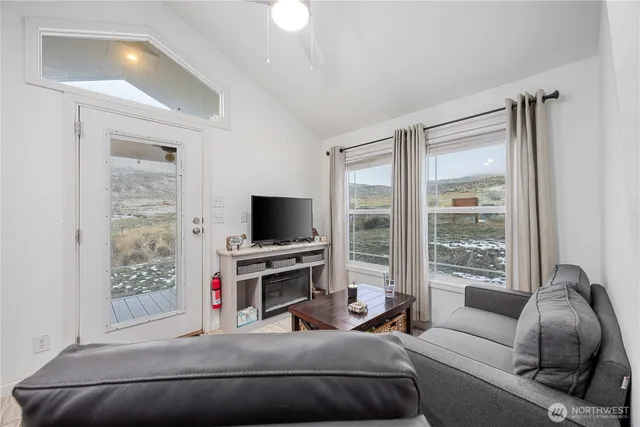 a living room with furniture and a window