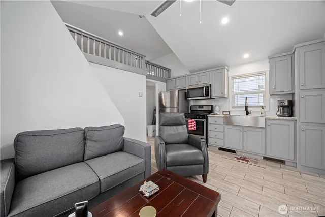 a living room with furniture and a rug