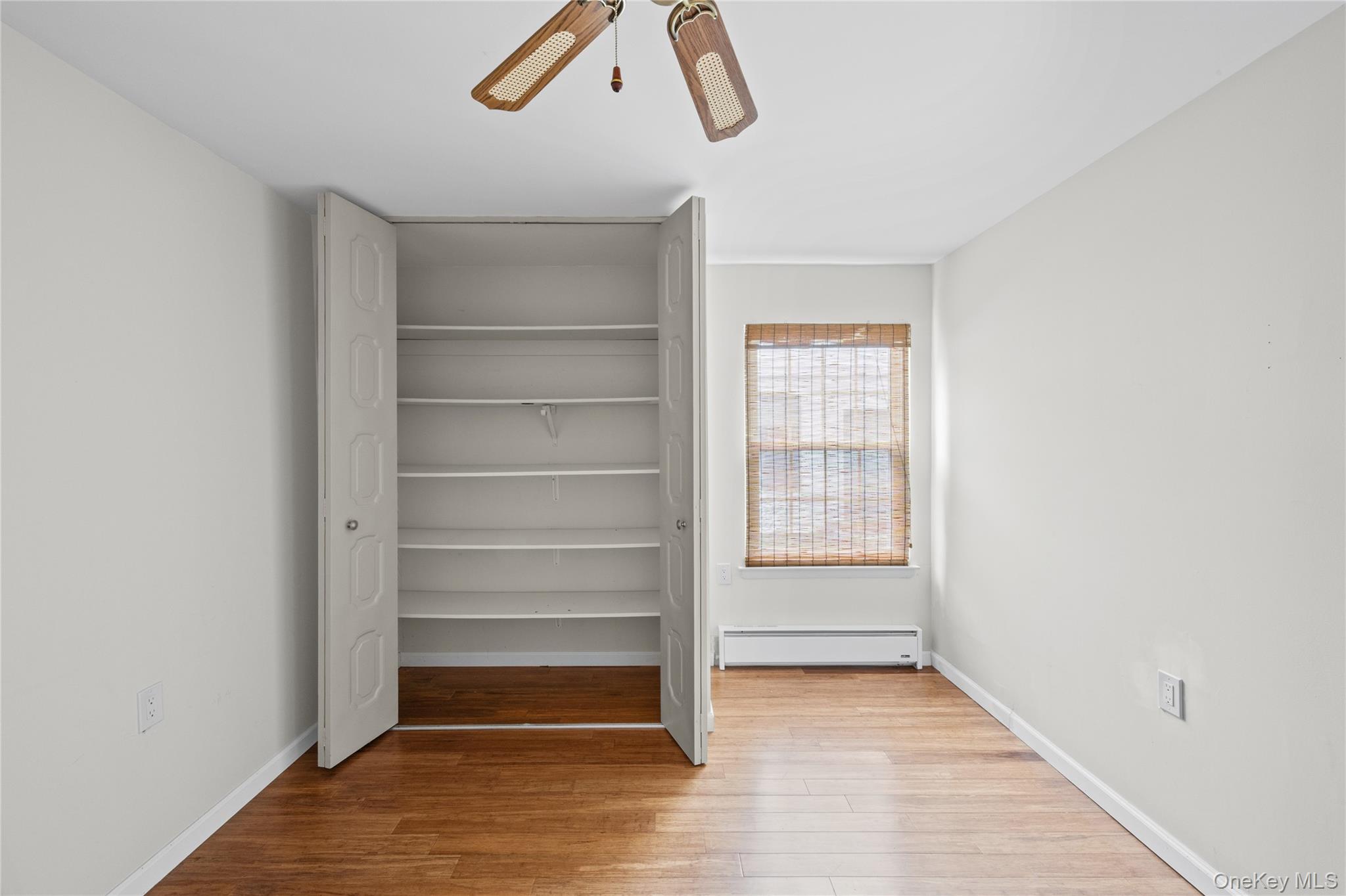 220 Belfast Lane Ridge, NY 11961 - Photo 38 of 44 a view of an empty room with a window