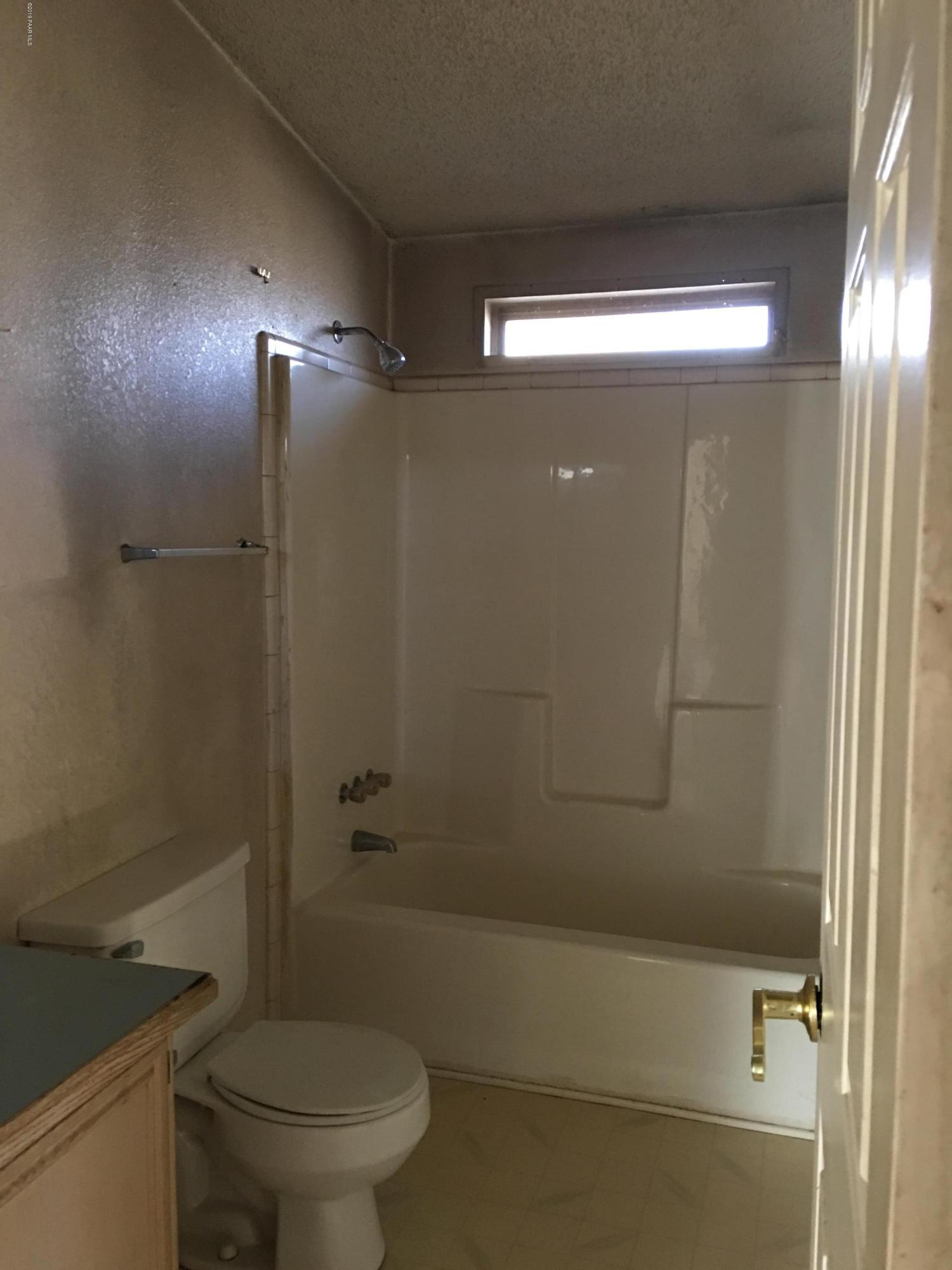 3467 Double A Ranch Road Williams, AZ 86046 - Photo 12 of 19 a bathroom with a shower and a toilet