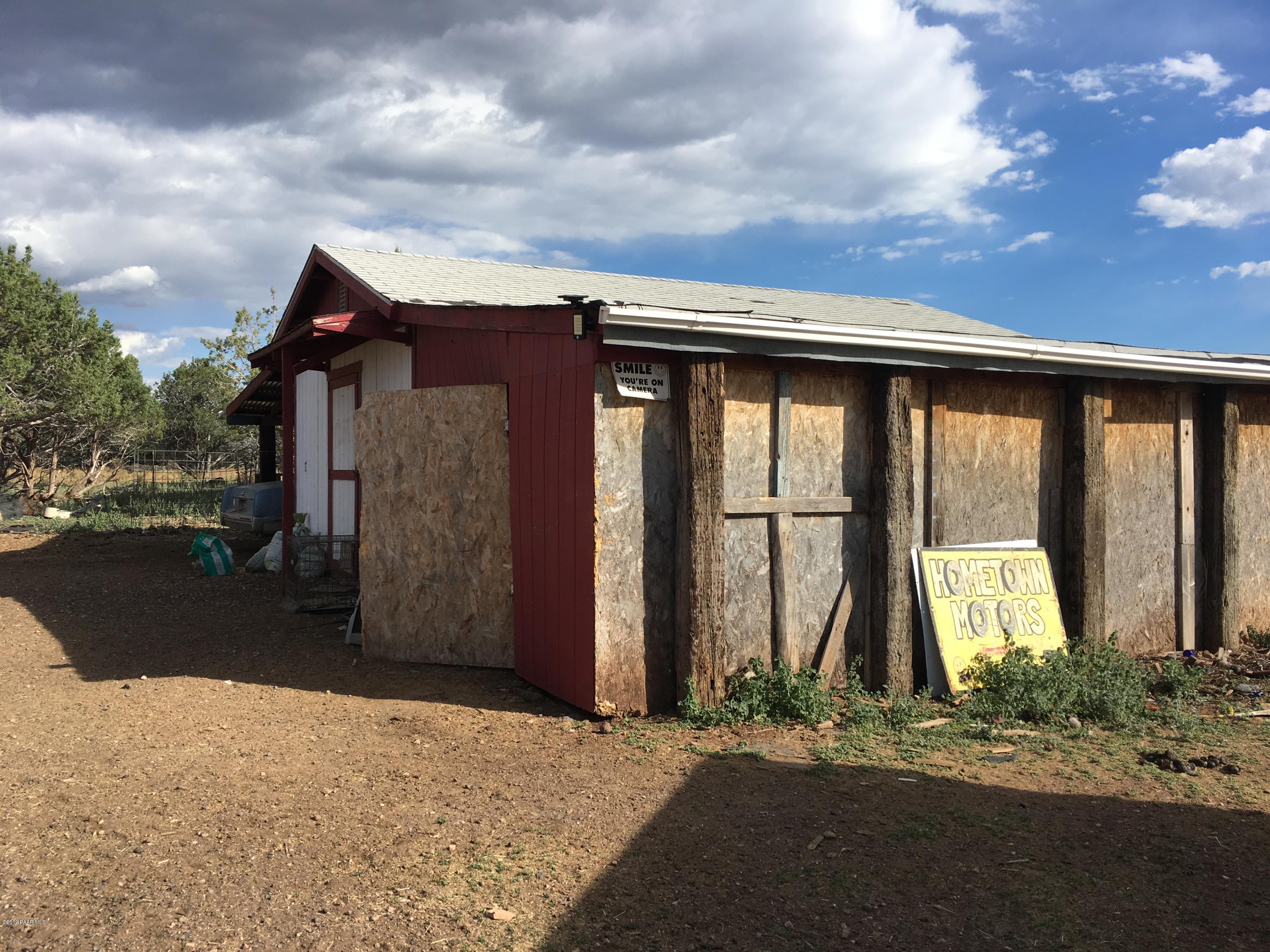 3467 Double A Ranch Road Williams, AZ 86046 - Photo 2 of 19 a view of house with backyard and parking space
