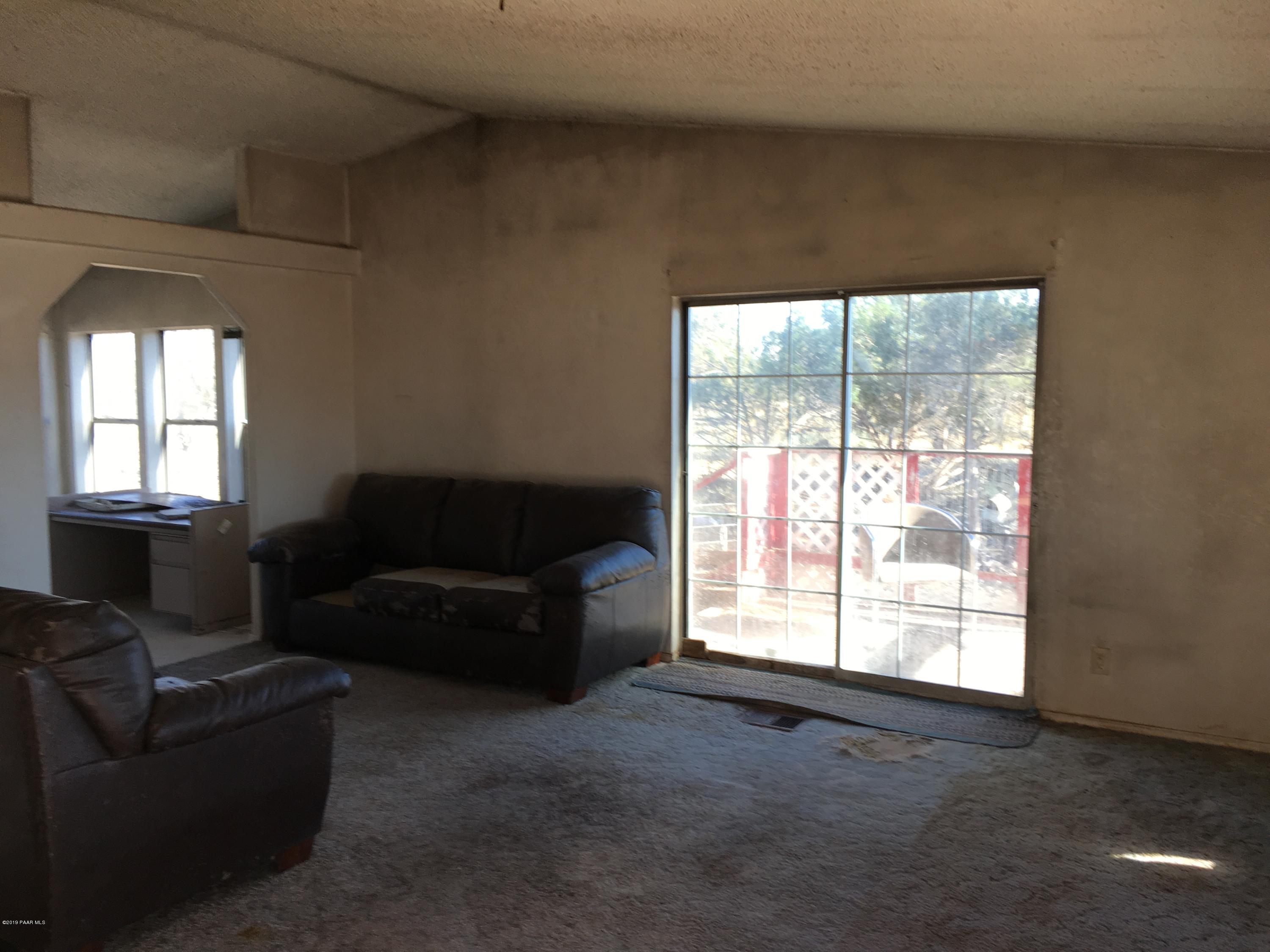 3467 Double A Ranch Road Williams, AZ 86046 - Photo 5 of 19 a living room with furniture and a window