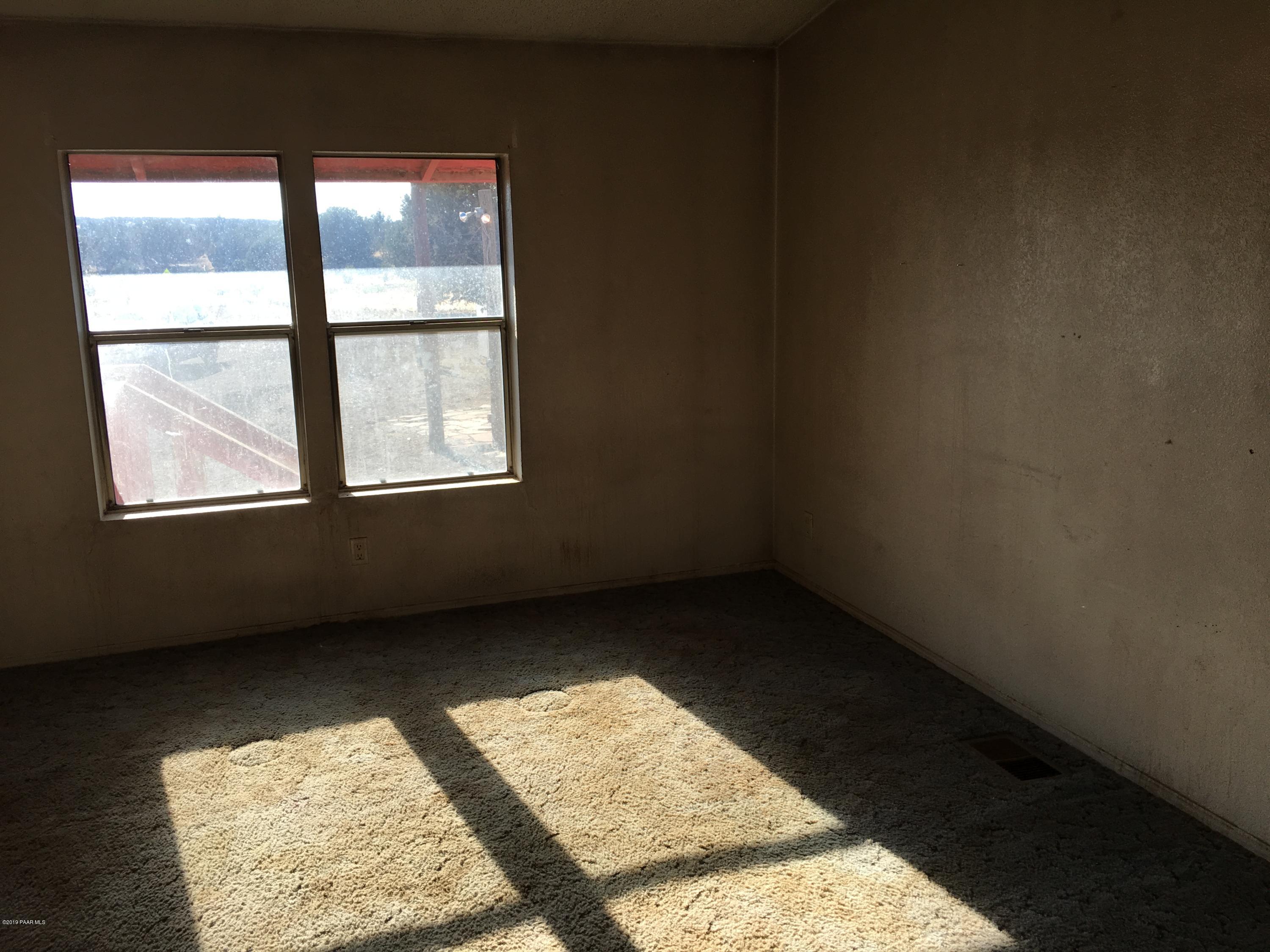 3467 Double A Ranch Road Williams, AZ 86046 - Photo 9 of 19 an empty room with a window