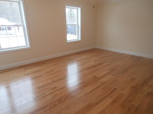 105 Gilbert Road Southampton, MA 01073 - Photo 16 of 21 an empty room with wooden floor and windows