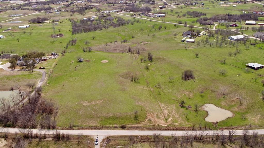 an aerial view of a residential houses with outdoor space