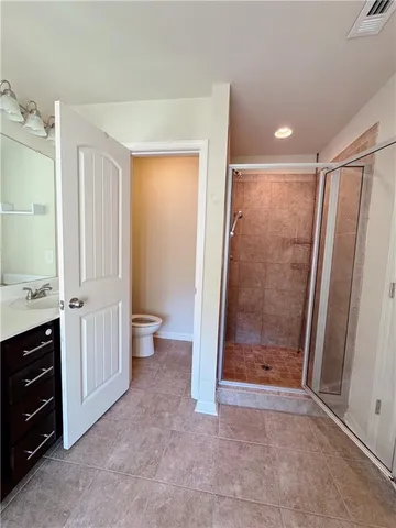 a bathroom with a shower and a toilet